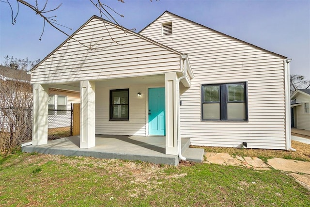 view of front of home featuring fence