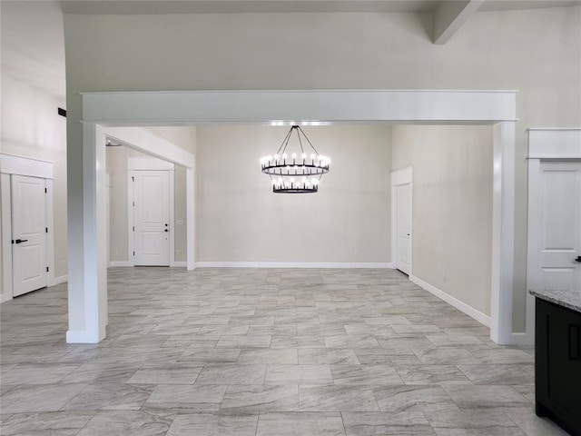 11613 NW 103rd St, Yukon, OK 73099 - unfurnished dining area featuring a chandelier and baseboards