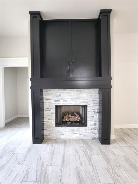 11613 NW 103rd St, Yukon, OK 73099 - detailed view of a fireplace and baseboards