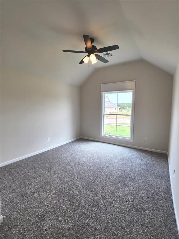 11613 NW 103rd St, Yukon, OK 73099 - additional living space with lofted ceiling, ceiling fan, carpet floors, and baseboards