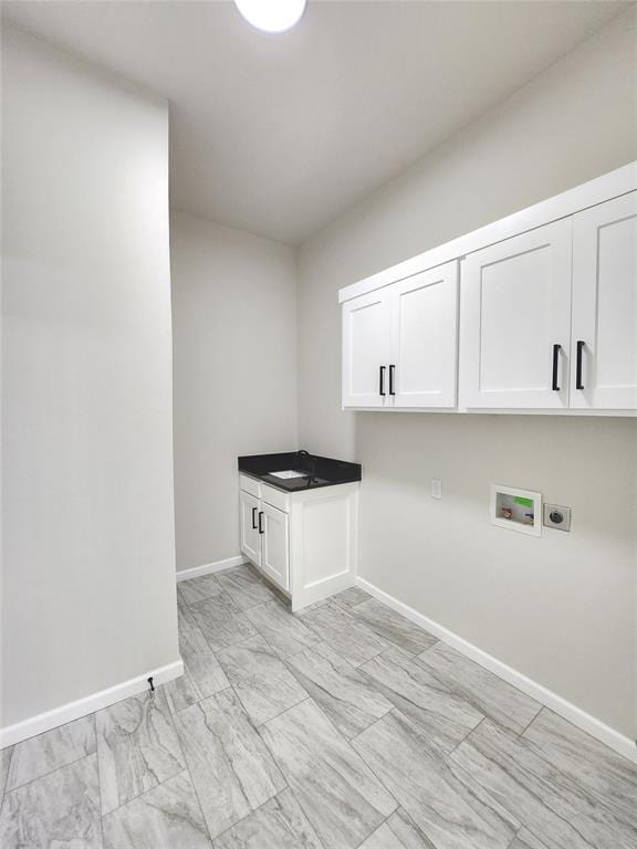11613 NW 103rd St, Yukon, OK 73099 - laundry room featuring electric dryer hookup, cabinet space, washer hookup, and baseboards