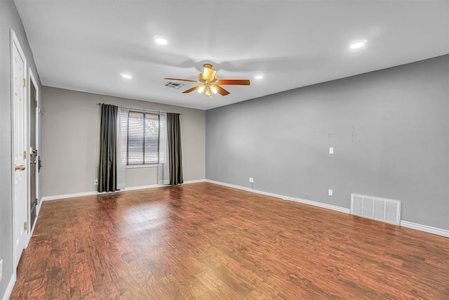 1724 N Lee St, Altus, OK 73521 - unfurnished room with visible vents, baseboards, ceiling fan, and wood finished floors