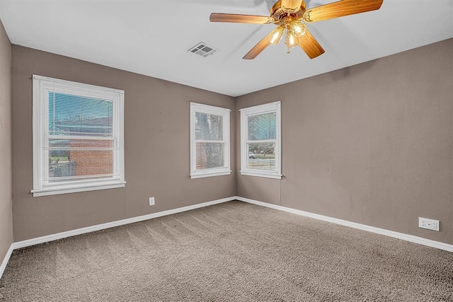 1724 N Lee St, Altus, OK 73521 - carpeted empty room featuring visible vents, baseboards, and ceiling fan