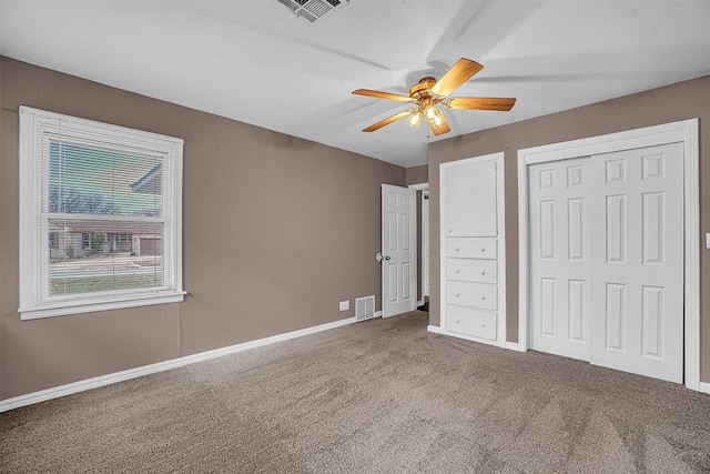 1724 N Lee St, Altus, OK 73521 - unfurnished bedroom with visible vents, ceiling fan, baseboards, and carpet