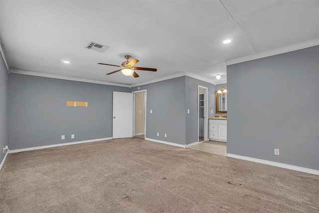 1724 N Lee St, Altus, OK 73521 - empty room featuring baseboards, visible vents, ornamental molding, ceiling fan, and light colored carpet