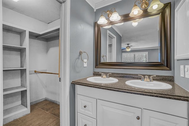 1724 N Lee St, Altus, OK 73521 - bathroom featuring double vanity, ornamental molding, a ceiling fan, and a sink