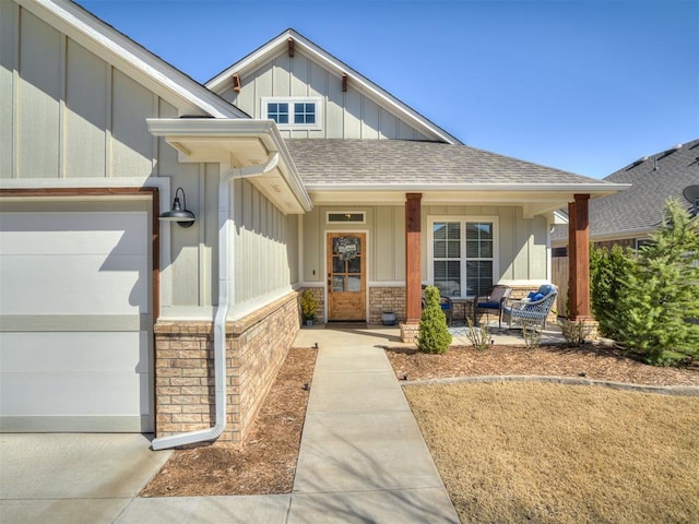 16304 Steppe Dr, Oklahoma City, OK 73170 - entrance to property featuring board and batten siding, roof with shingles, a porch, and an attached garage