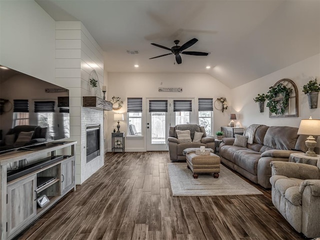 16304 Steppe Dr, Oklahoma City, OK 73170 - living room with a ceiling fan, lofted ceiling, a fireplace, dark wood finished floors, and recessed lighting