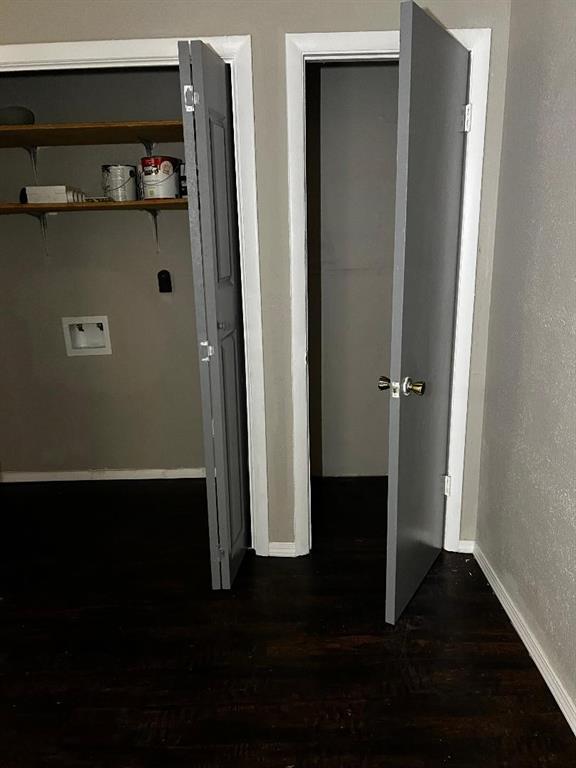 2513 N Nottingham Way, Moore, OK 73160 - hall with dark wood-style floors and baseboards