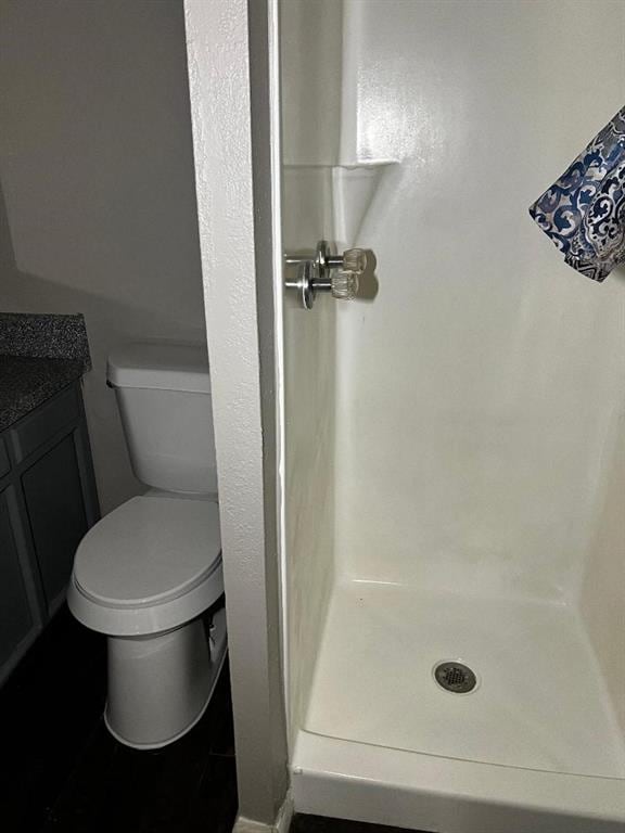 2513 N Nottingham Way, Moore, OK 73160 - full bath with a stall shower, toilet, and vanity