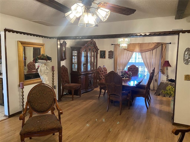 2416 SW 92nd St, Oklahoma City, OK 73159 - dining room with visible vents, a ceiling fan, wood finished floors, and a textured ceiling