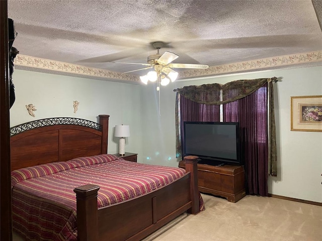 2416 SW 92nd St, Oklahoma City, OK 73159 - bedroom with ceiling fan, baseboards, light colored carpet, and a textured ceiling