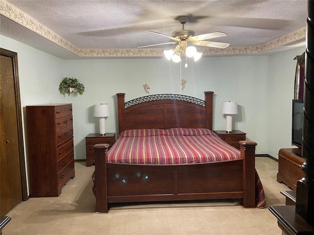 2416 SW 92nd St, Oklahoma City, OK 73159 - bedroom featuring light colored carpet, a ceiling fan, baseboards, and a textured ceiling
