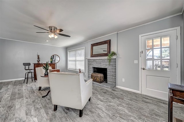 3316 NW 60th, Oklahoma City, OK 73112 - living room with light wood-style flooring, a wealth of natural light, crown molding, and a stone fireplace