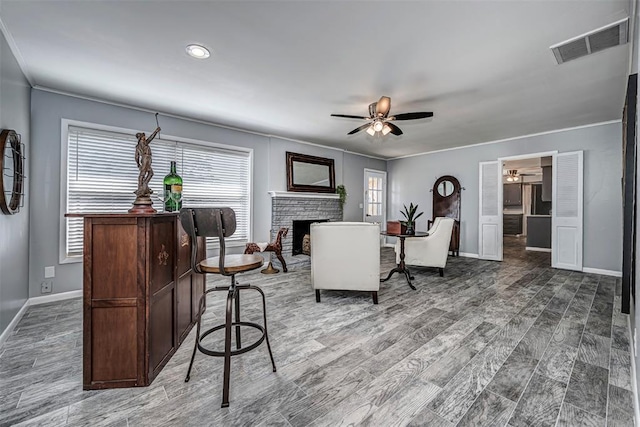 3316 NW 60th, Oklahoma City, OK 73112 - living area with ceiling fan, baseboards, a healthy amount of sunlight, and visible vents