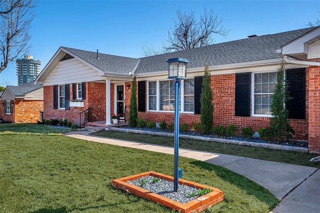 3316 NW 60th, Oklahoma City, OK 73112 - ranch-style house with brick siding, a front yard, and a shingled roof