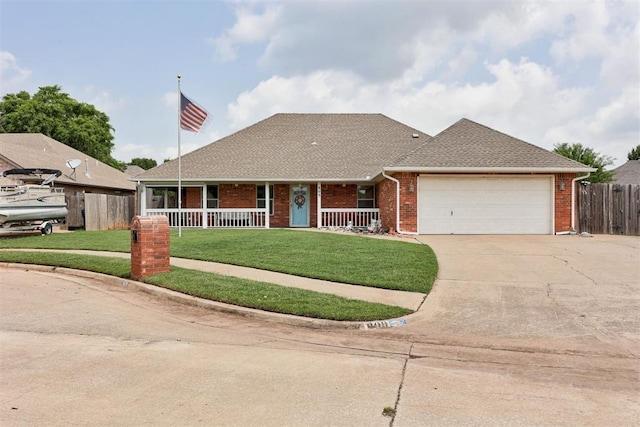 809 W Cherokee Way, Mustang, OK 73064 - view of front of home with concrete driveway, an attached garage, covered porch, brick siding, and roof with shingles