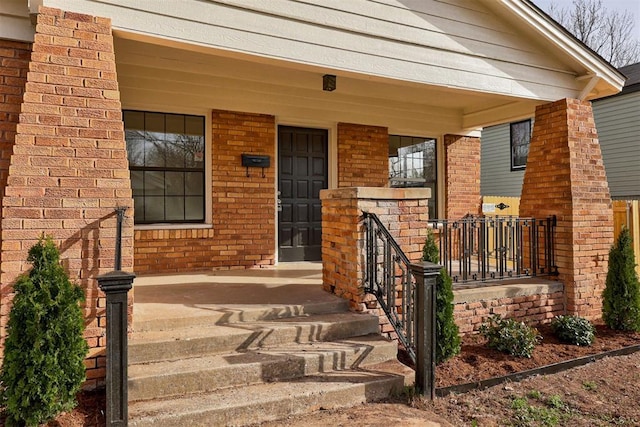 1721 NW 35th St, Oklahoma City, OK 73118 - doorway to property with brick siding and a porch