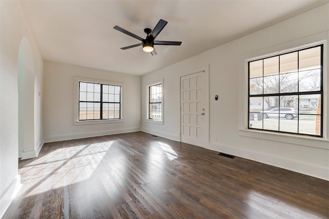 1721 NW 35th St, Oklahoma City, OK 73118 - foyer entrance with dark wood-type flooring, baseboards, visible vents, and ceiling fan