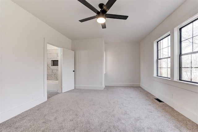 1721 NW 35th St, Oklahoma City, OK 73118 - carpeted spare room featuring visible vents, baseboards, and a ceiling fan