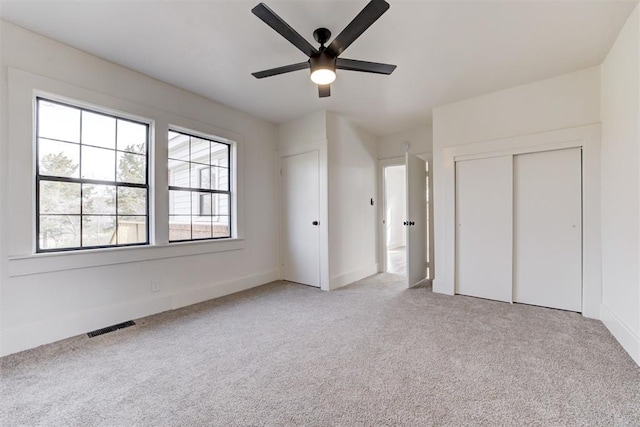 1721 NW 35th St, Oklahoma City, OK 73118 - unfurnished bedroom featuring ceiling fan, baseboards, visible vents, and light carpet