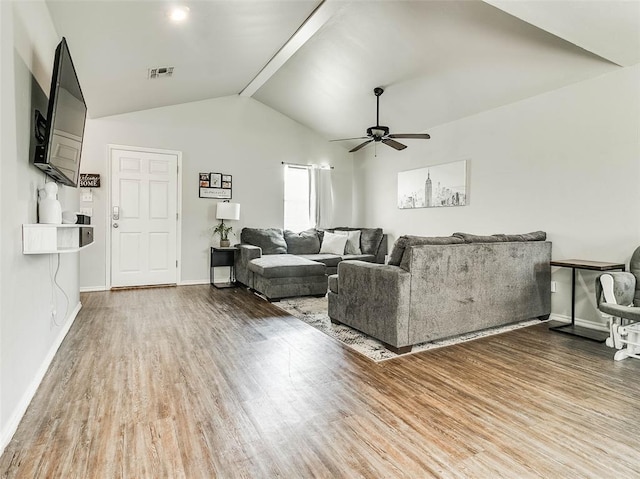 1415 NW 98th St, Oklahoma City, OK 73114 - living room with visible vents, a ceiling fan, wood finished floors, baseboards, and vaulted ceiling