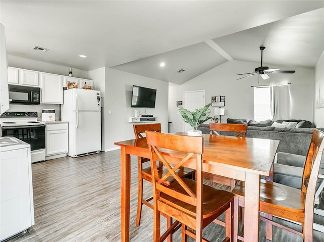 1415 NW 98th St, Oklahoma City, OK 73114 - dining area featuring ceiling fan, lofted ceiling with beams, visible vents, and light wood-type flooring