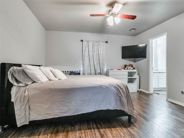 1415 NW 98th St, Oklahoma City, OK 73114 - bedroom featuring visible vents, ensuite bath, wood finished floors, baseboards, and ceiling fan