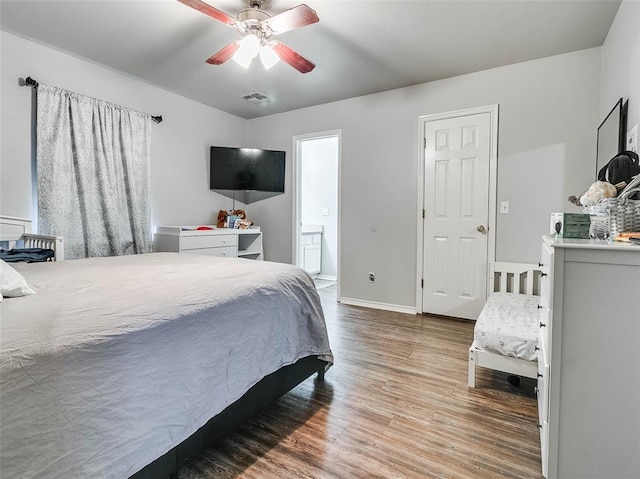 1415 NW 98th St, Oklahoma City, OK 73114 - bedroom featuring a ceiling fan, wood finished floors, visible vents, baseboards, and connected bathroom