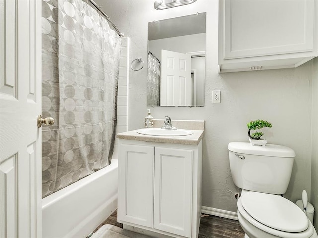 1415 NW 98th St, Oklahoma City, OK 73114 - bathroom with shower / bathtub combination with curtain, toilet, wood finished floors, baseboards, and vanity