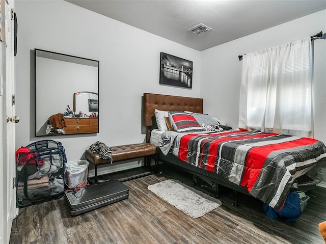 1415 NW 98th St, Oklahoma City, OK 73114 - bedroom with visible vents and wood finished floors