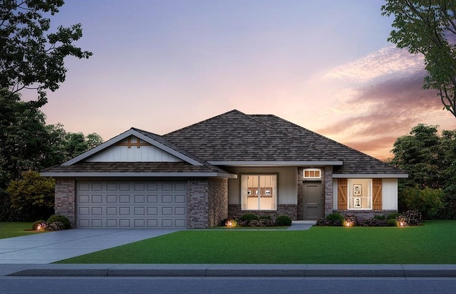 ranch-style house featuring a lawn, an attached garage, concrete driveway, and brick siding