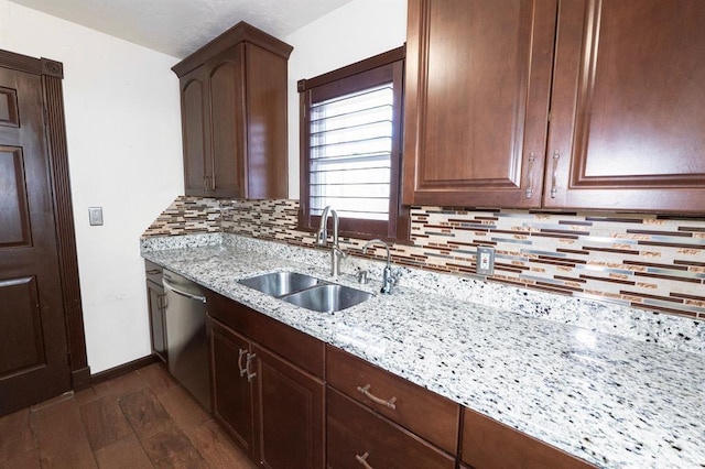 2935 NW Grand Blvd, Oklahoma City, OK 73116 - kitchen with tasteful backsplash, a sink, light stone counters, dark wood-style floors, and stainless steel dishwasher