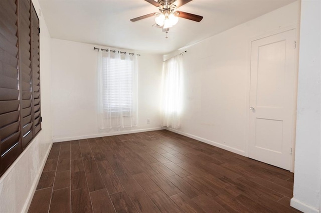 2935 NW Grand Blvd, Oklahoma City, OK 73116 - empty room with baseboards, a ceiling fan, and dark wood-style flooring