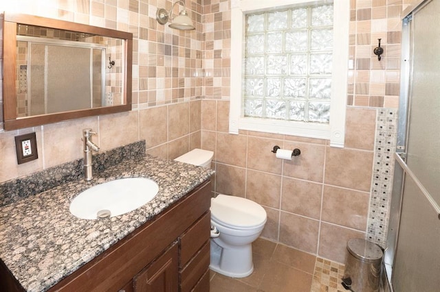 2935 NW Grand Blvd, Oklahoma City, OK 73116 - bathroom with tile walls, toilet, and a stall shower