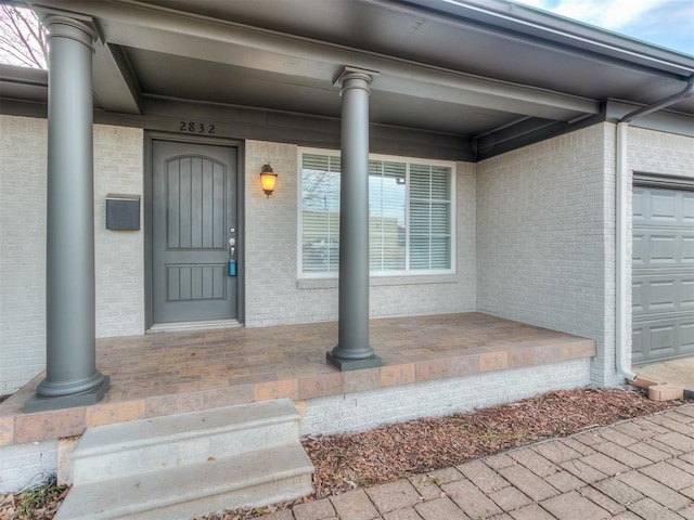 2832 Warwick Dr, Oklahoma City, OK 73116 - entrance to property featuring brick siding and covered porch
