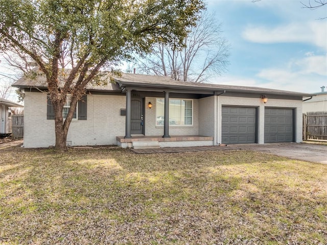 2832 Warwick Dr, Oklahoma City, OK 73116 - single story home with a front lawn, a garage, brick siding, and driveway