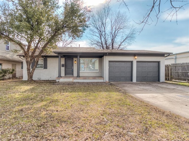 2832 Warwick Dr, Oklahoma City, OK 73116 - ranch-style house with a front lawn, an attached garage, fence, and driveway