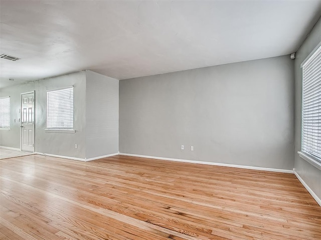 2832 Warwick Dr, Oklahoma City, OK 73116 - unfurnished room featuring light wood-type flooring, visible vents, and baseboards