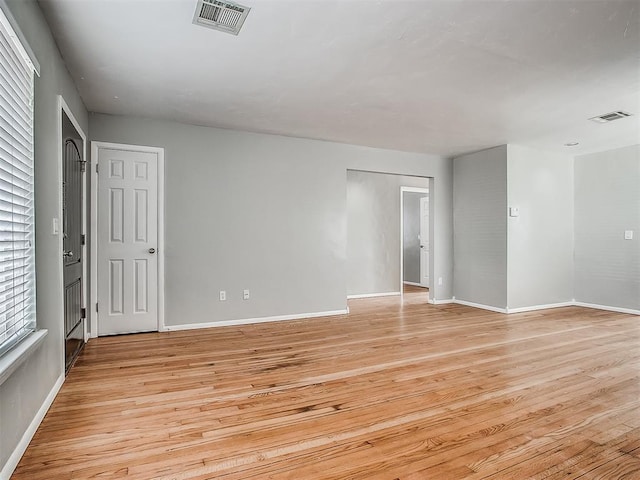 2832 Warwick Dr, Oklahoma City, OK 73116 - unfurnished room featuring baseboards, visible vents, and light wood-type flooring