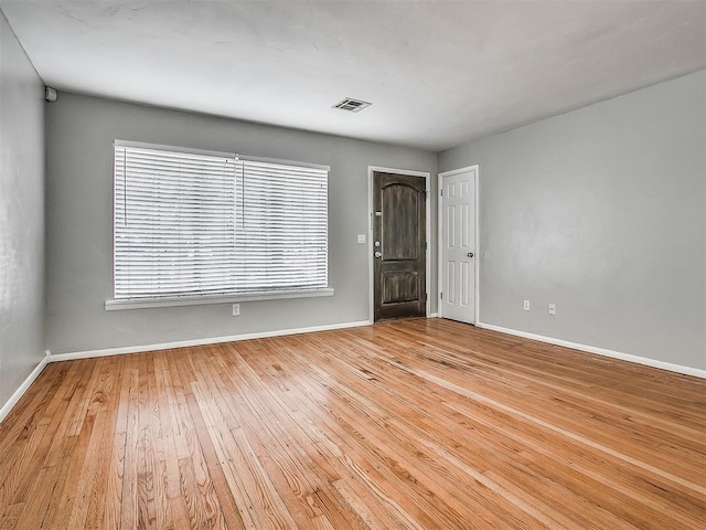 2832 Warwick Dr, Oklahoma City, OK 73116 - spare room featuring light wood-type flooring, visible vents, and baseboards