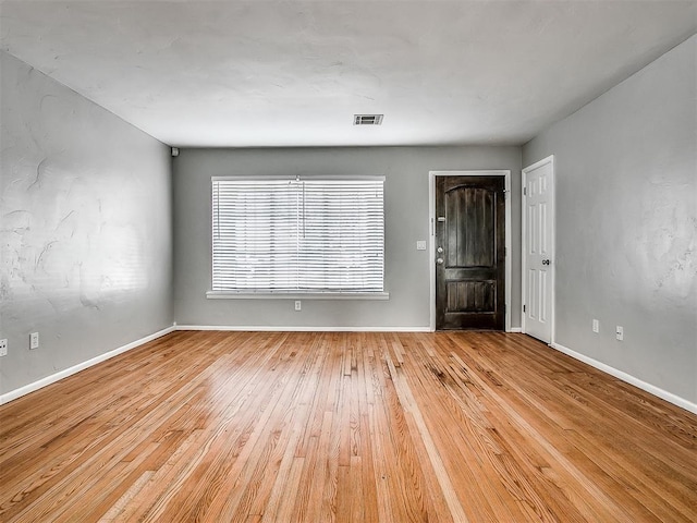 2832 Warwick Dr, Oklahoma City, OK 73116 - spare room featuring visible vents, baseboards, and hardwood / wood-style flooring