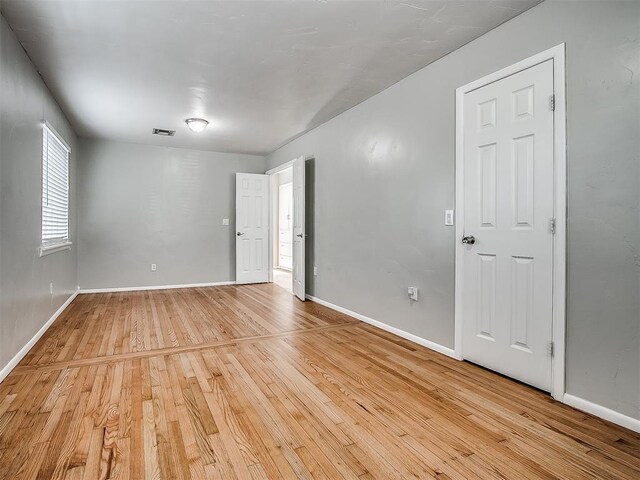 2832 Warwick Dr, Oklahoma City, OK 73116 - empty room featuring light wood-style floors, visible vents, and baseboards