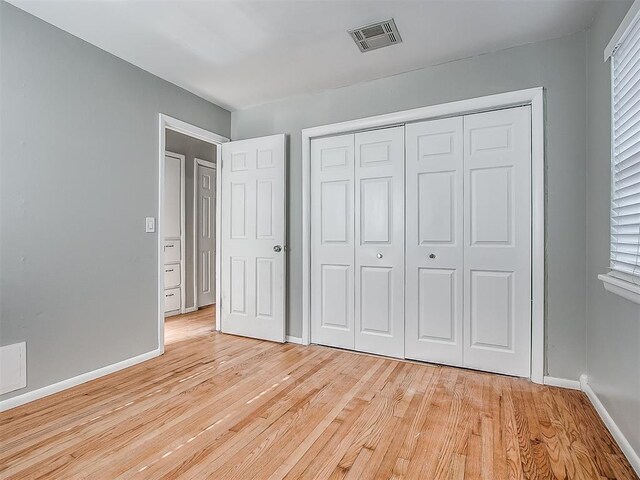 2832 Warwick Dr, Oklahoma City, OK 73116 - unfurnished bedroom with visible vents, baseboards, and light wood-style floors