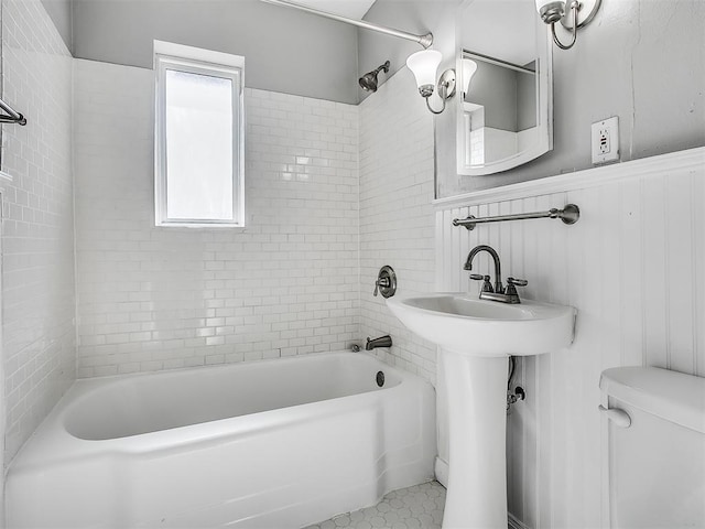 2832 Warwick Dr, Oklahoma City, OK 73116 - full bathroom with  shower combination, toilet, and a wainscoted wall