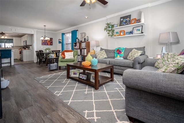 living room with a ceiling fan, plenty of natural light, and crown molding