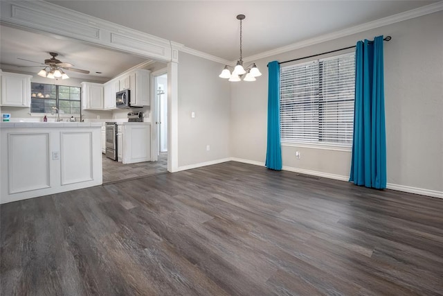 4505 N Peniel Ave, Bethany, OK 73008 - kitchen featuring stainless steel appliances, a chandelier, dark wood-style flooring, white cabinets, and ornamental molding