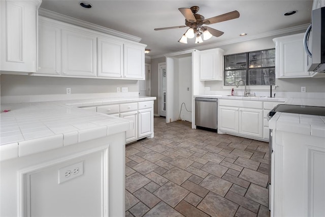 4505 N Peniel Ave, Bethany, OK 73008 - kitchen featuring appliances with stainless steel finishes, tile countertops, a ceiling fan, white cabinetry, and ornamental molding