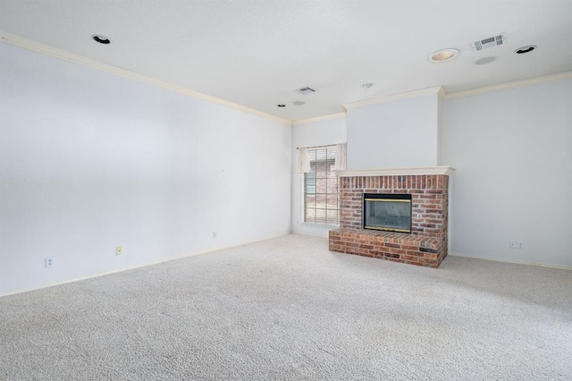 unfurnished living room featuring visible vents, a fireplace, crown molding, and carpet