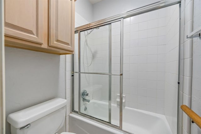 full bath featuring enclosed tub / shower combo and toilet